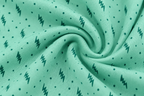 Mint women’s stretch-knit pajama set — solid long-sleeve top and printed trousers, zigzag-and-dot knit fabric close-up